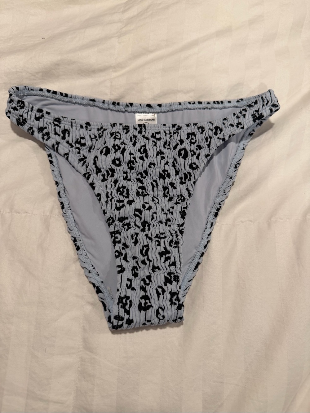 Good American Light Blue Smocked One-Piece with Black cheetah Print